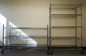 TWO MODERN STAINLESS STEEL POR