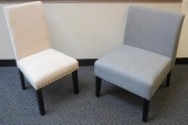 TWO MODERN UPHOLSTERED ARMLESS