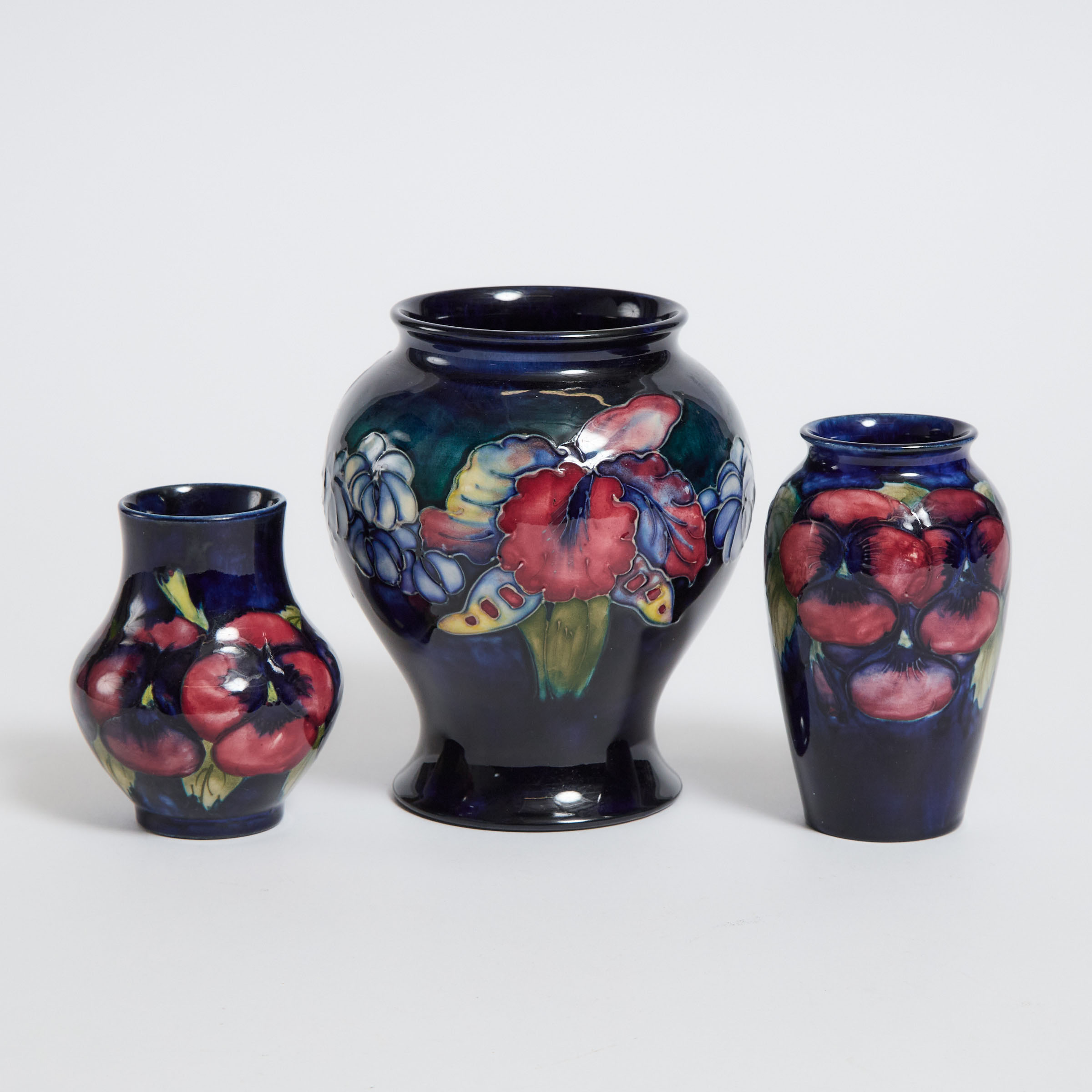 Two Moorcroft Pansy Vases and an
