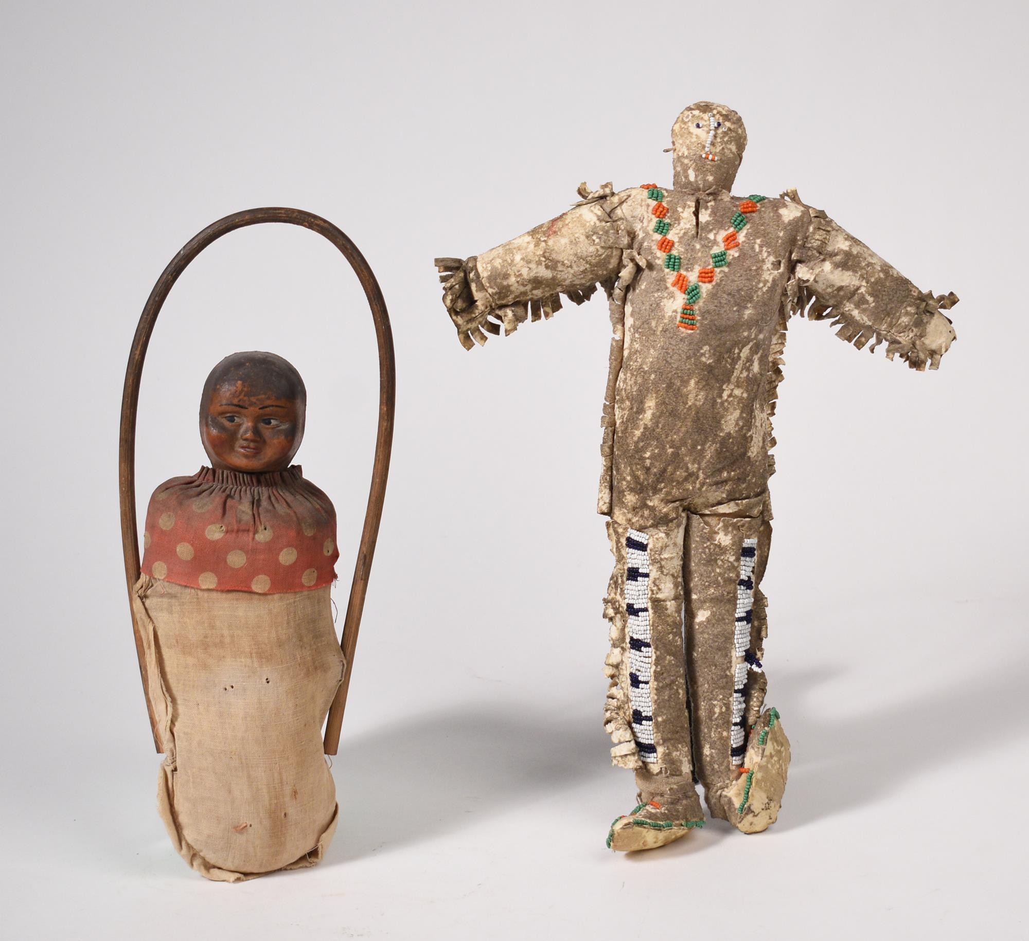 TWO NATIVE AMERICAN DOLLS. One