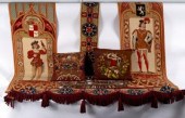 Two needlework cushions, a nee