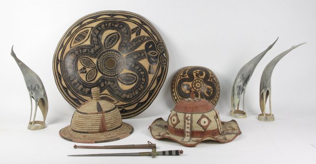 Two Nigerian straw work hats a bark