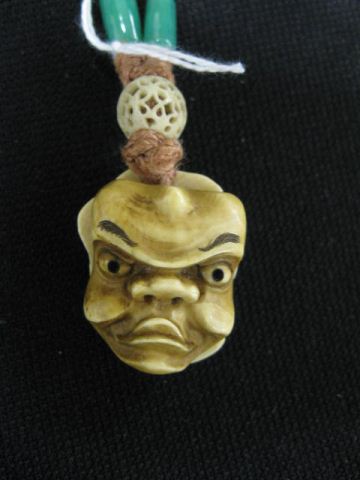 Two Noh Mask Ivory Netsuke back