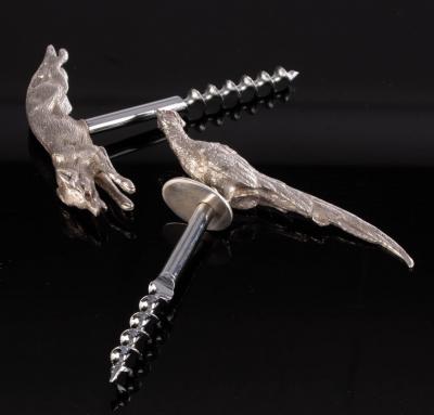 Two novelty silver corkscrews,