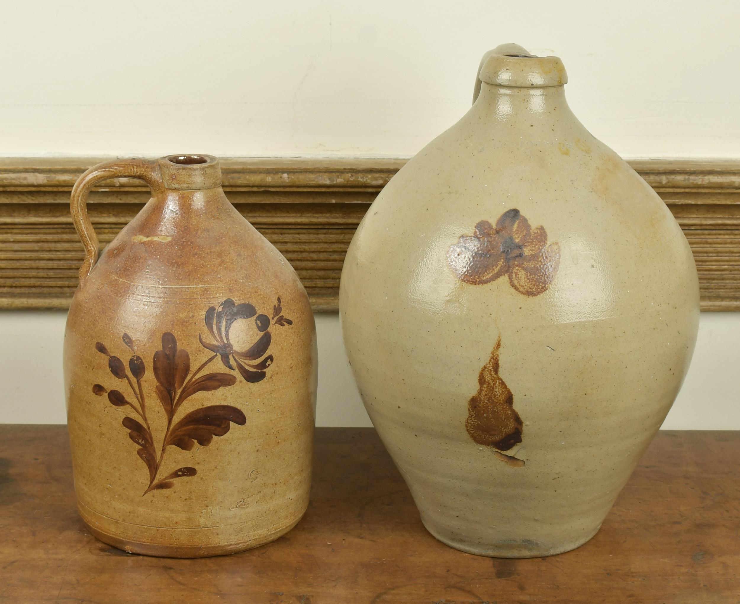 TWO OCHRE DECORATED STONEWARE JUGS.