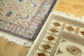 TWO ORIENTAL STYLE AREA RUGS.