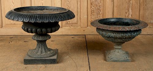 TWO PAINTED CAST IRON GARDEN URNS