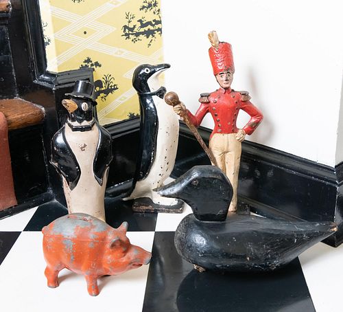 TWO PAINTED CAST IRON PENGUIN