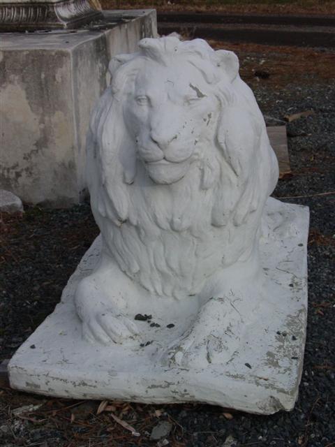 TWO PAINTED CAST STONE RECUMBENT