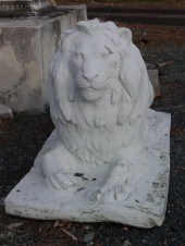 TWO PAINTED CAST STONE RECUMBE