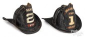 TWO PAINTED LEATHER FIRE HELME