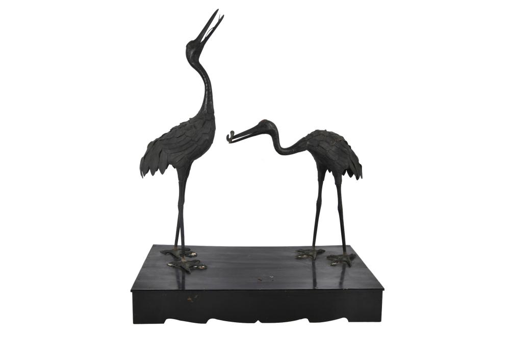 TWO PAINTED METAL STORKSpot