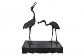 TWO PAINTED METAL STORKSpot me