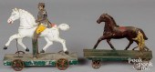 TWO PAINTED TIN HORSE PLATFORM