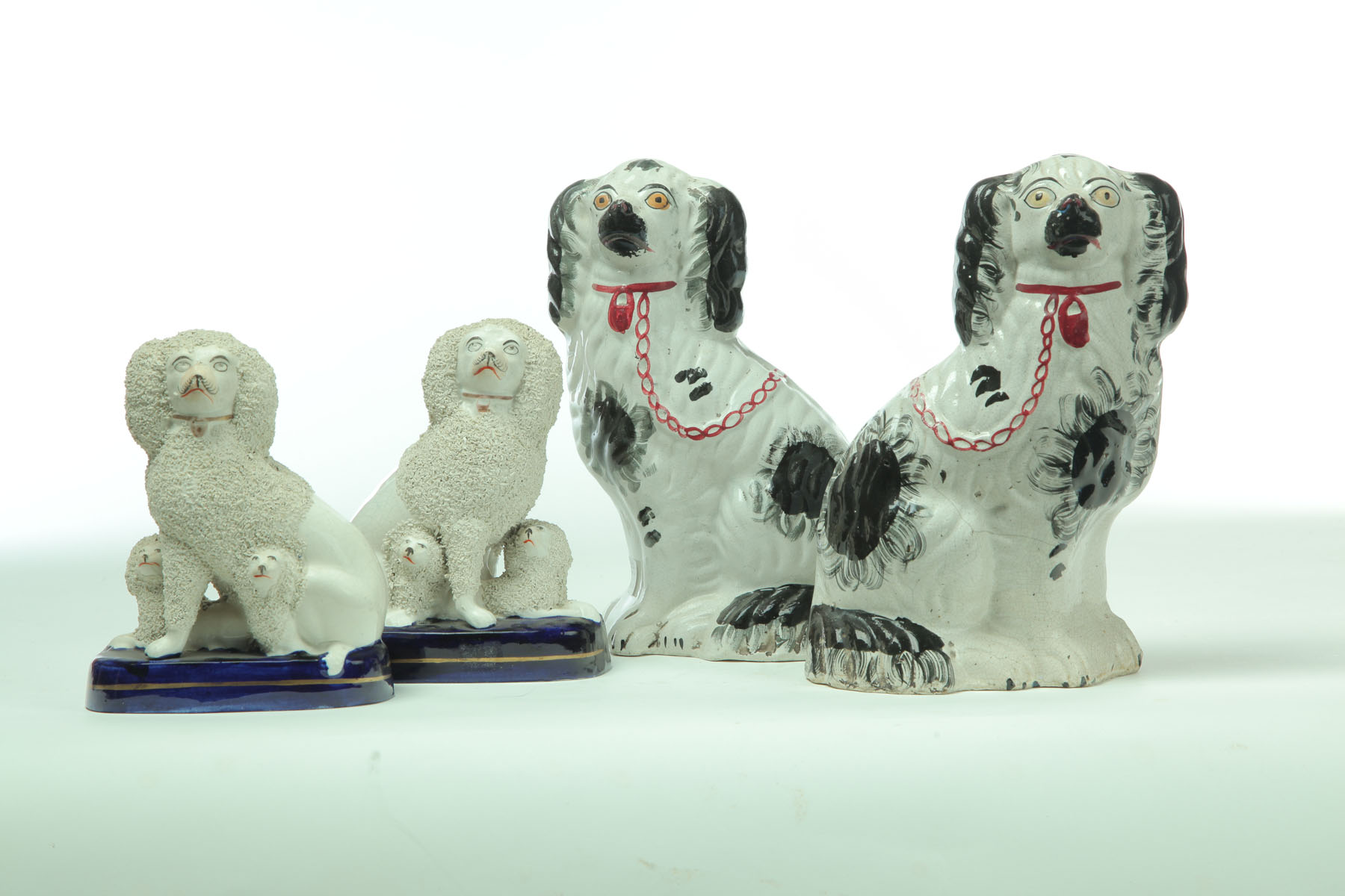 TWO PAIR OF STAFFORDSHIRE DOGS. 