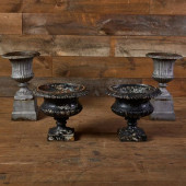TWO PAIRS OF CAST-IRON URNS<br