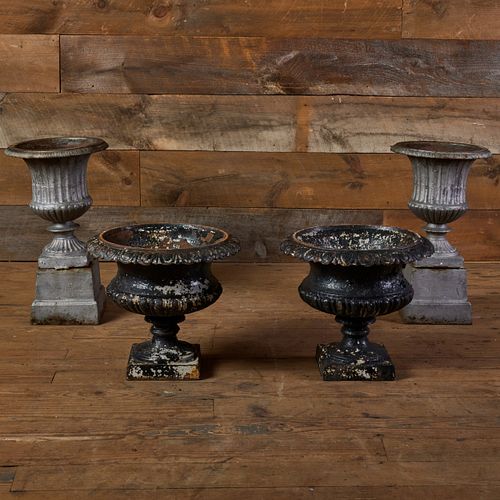 TWO PAIRS OF CAST-IRON URNSThe