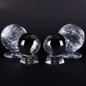 TWO PAIRS OF GLASS SPHERES ON