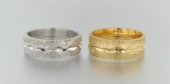 Two Pairs of Gold Bands Contai