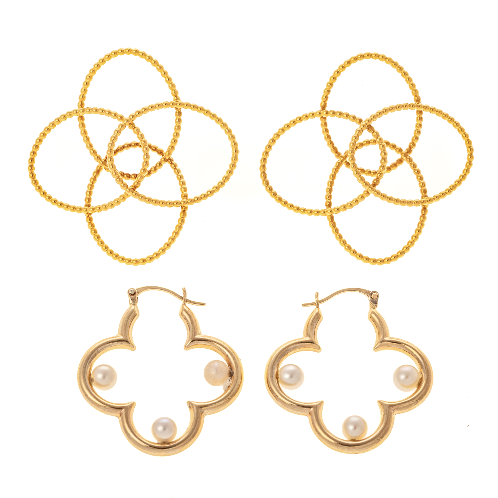 TWO PAIRS OF STYLIZED ROSETTE