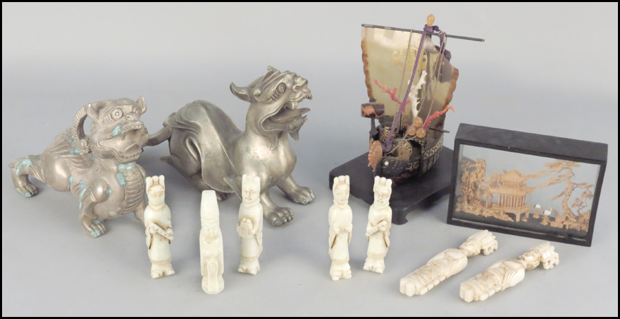 TWO PATINATED METAL FOO DOGS.