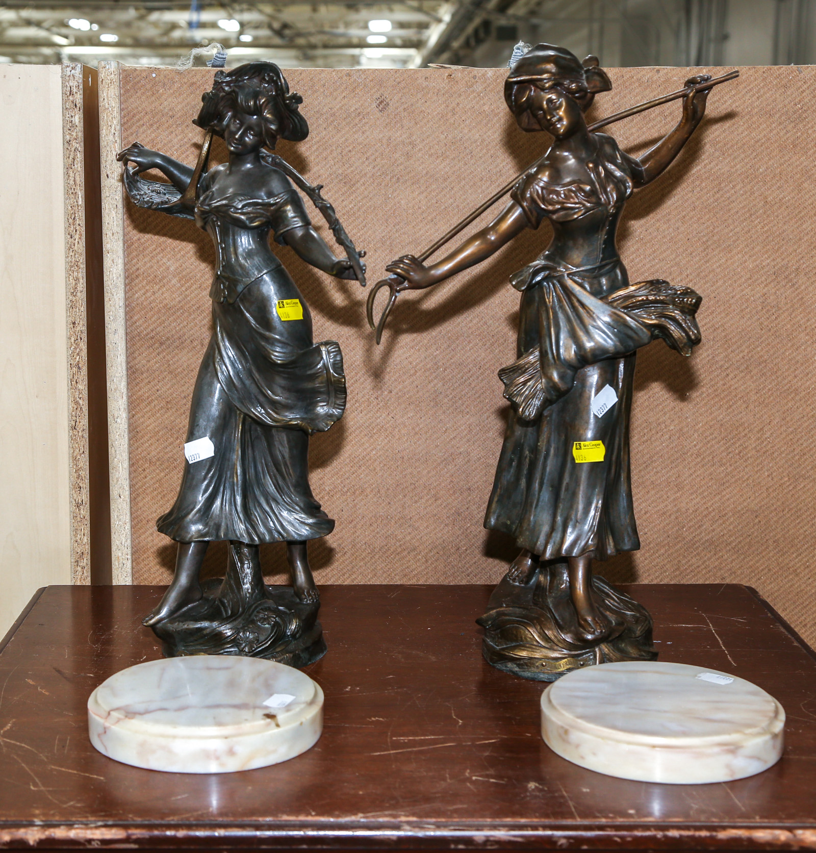 TWO PATINATED WHITE METAL FARM GIRL