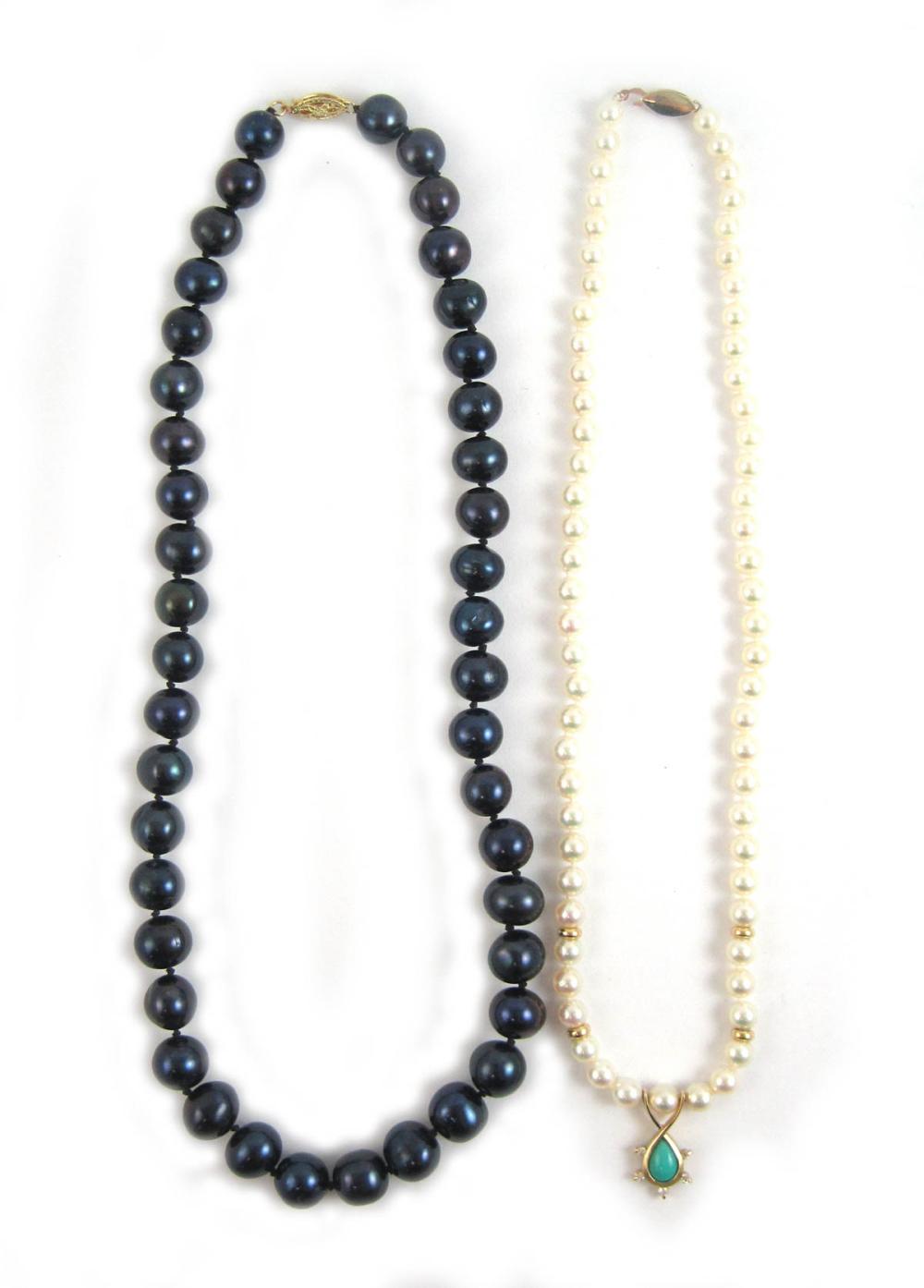 TWO PEARL AND FOURTEEN KARAT GOLD
