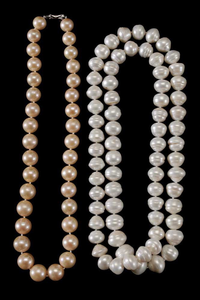 Two Pearl Necklaces one set with 34