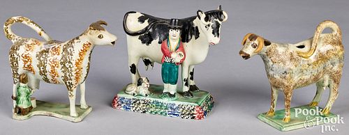 TWO PEARLWARE COW CREAMERS AND