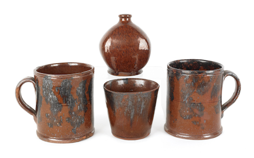 Two Pennsylvania redware mugs early