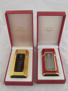 Two perfume bottles by Cartier in