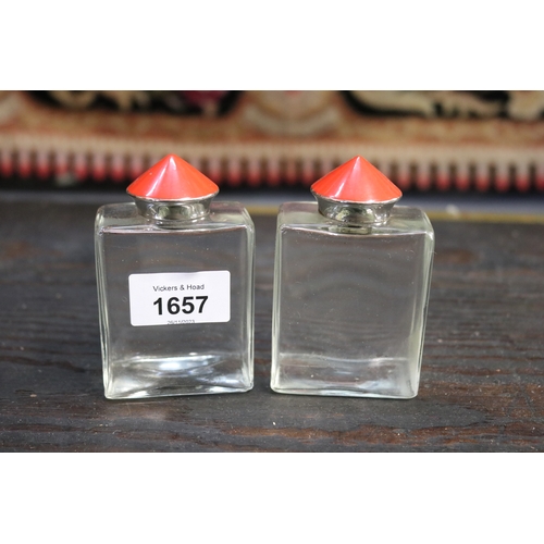 Two perfume bottles, red enamel