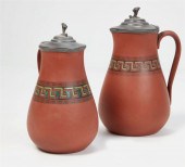 TWO PEWTER AND RED WARE PITCHE