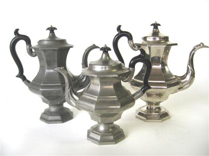 Two pewter coffeepots and a