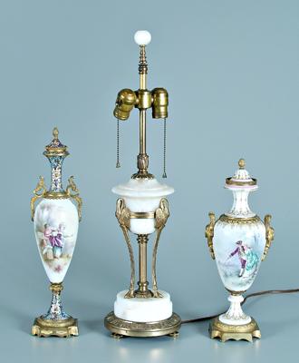 Two porcelain, one marble urns: one