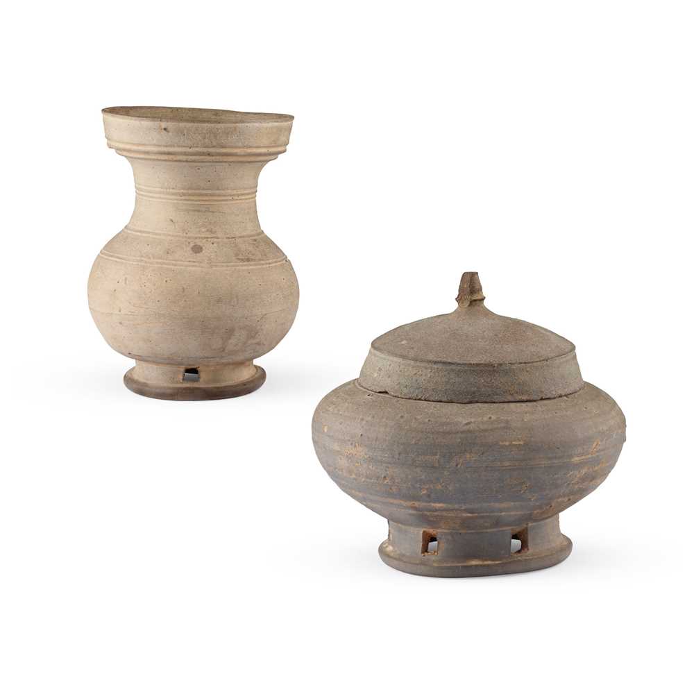 TWO POTTERY JARS WITH PIERCED