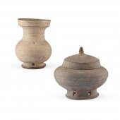 TWO POTTERY JARS WITH PIERCED