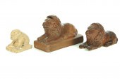 TWO POTTERY LIONS AND A DOG.
