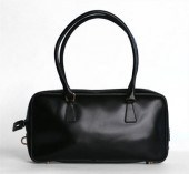 Two Prada handbags    One smal