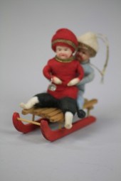 TWO PRESSED COTTON CHILDREN ON