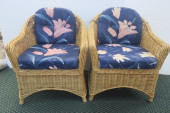 TWO RATTAN ARM CHAIRS WITH CUS