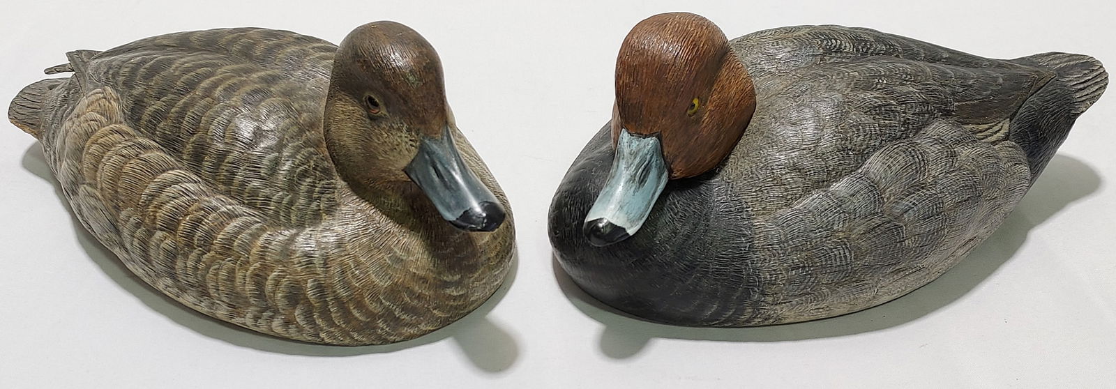 TWO RAY BAIRD CARVED WOOD DECOYS: