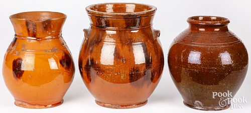 TWO REDWARE CROCKS AND A PITCHER