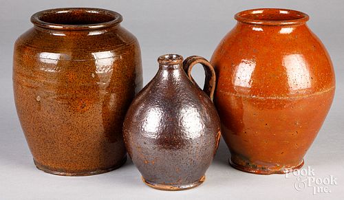 TWO REDWARE CROCKS AND A JUG,