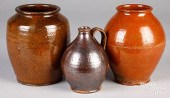 TWO REDWARE CROCKS AND A JUG,