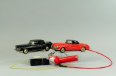 TWO REMOTE CONTROLLED AUTOS Ja