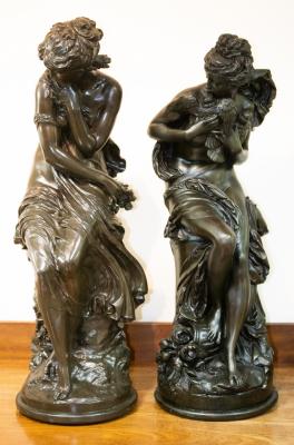 Two resin statues each depicting