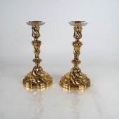 TWO ROCOCO-STYLE BRASS CANDLES