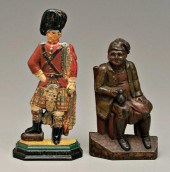 Two Scottish cast iron doorsto