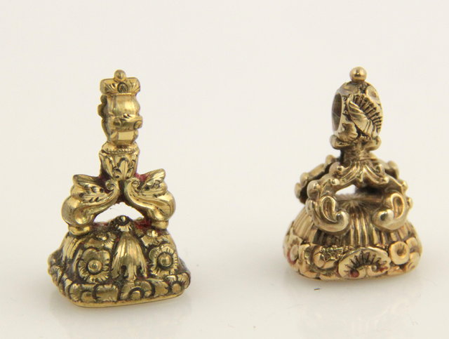 Two seal fobs each with pierced